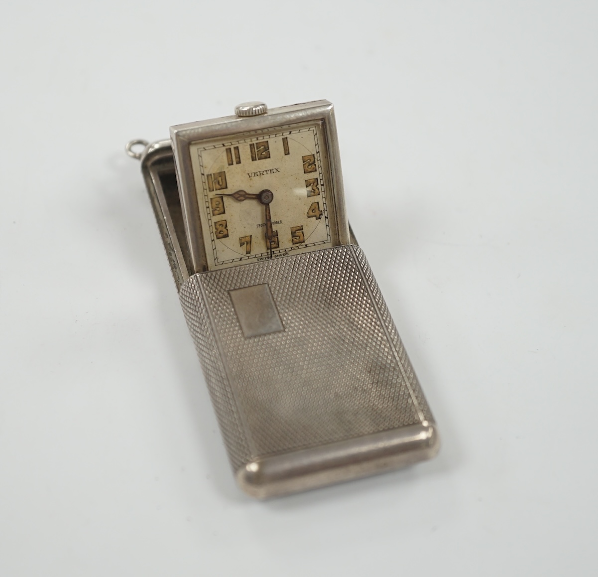 A 1920's? Swiss Vertex engine turned silver cased travelling watch, 42mm.